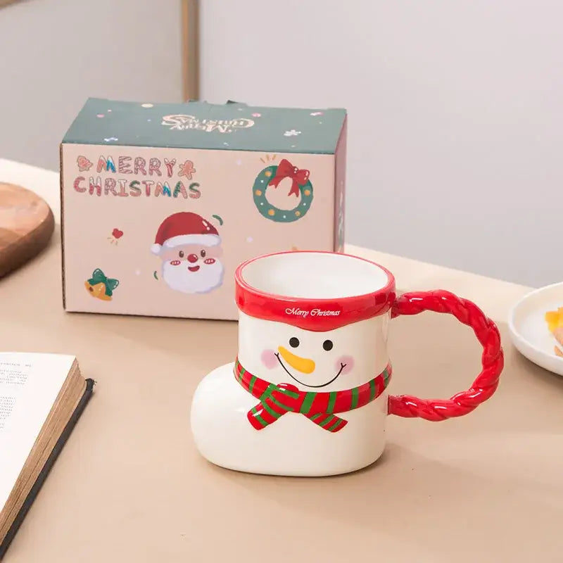 White ceramic snowman mug with red braided handle and merry christmas rim text from decorbites lovely christmas socks ceramic collection