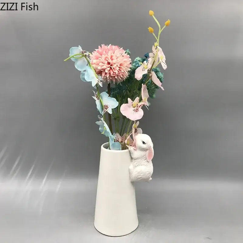 White ceramic vase with sculpted bunny figurine holding pastel flowers decorbites lovely rabbit ceramic vase
