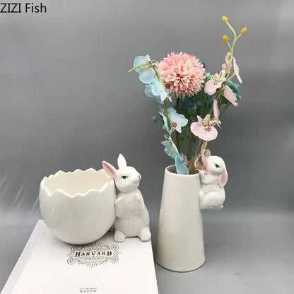 White ceramic vase shaped like a rabbit with a small bunny figurine peeking out decorbites lovely rabbit ceramic vase