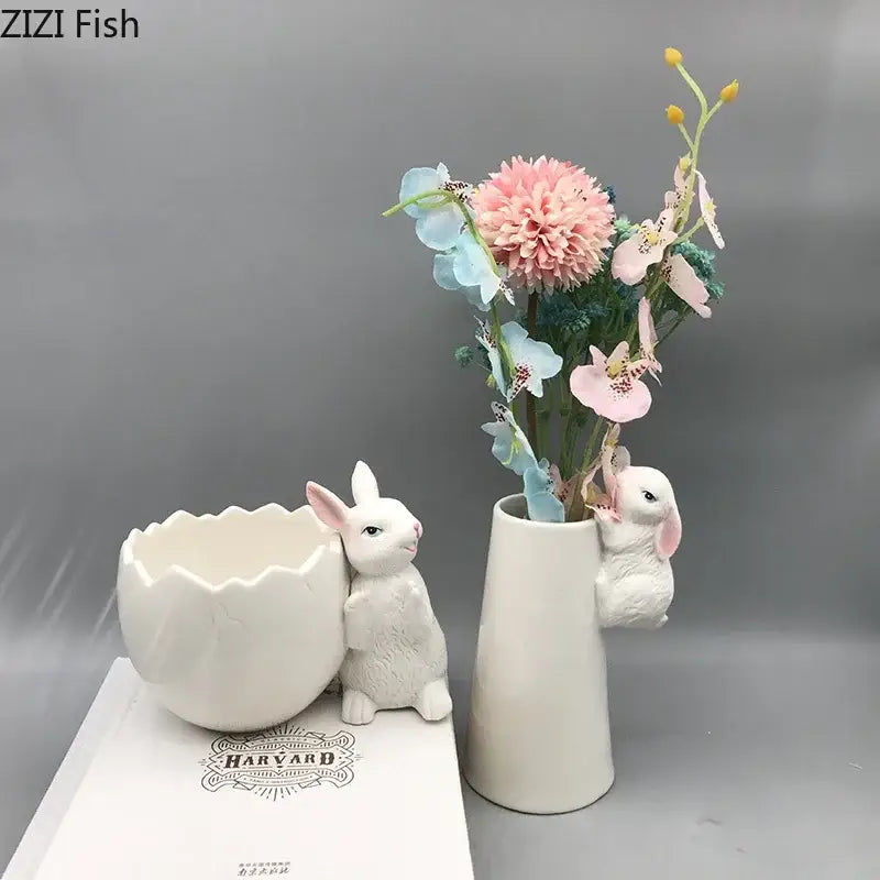 White ceramic vase shaped like a rabbit with a small bunny figurine peeking out decorbites lovely rabbit ceramic vase