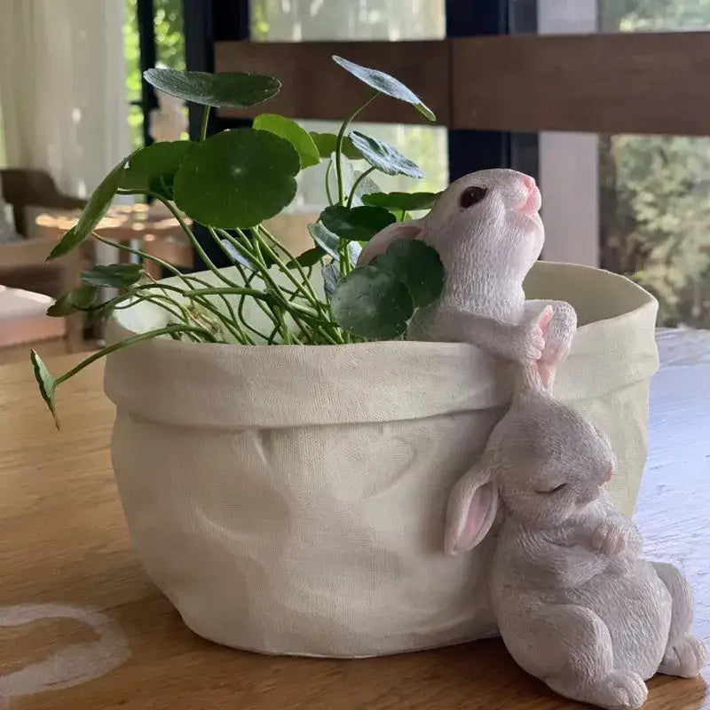 Cream-colored fabric rabbit garden flowerpot with two white resin lovely rabbit figurines for balcony decor