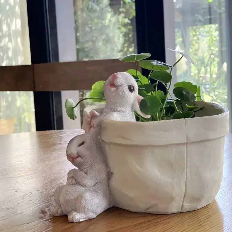 DecorBites lovely rabbit garden white resin rabbit garden flowerpot with sitting and peeking rabbits holding green plants