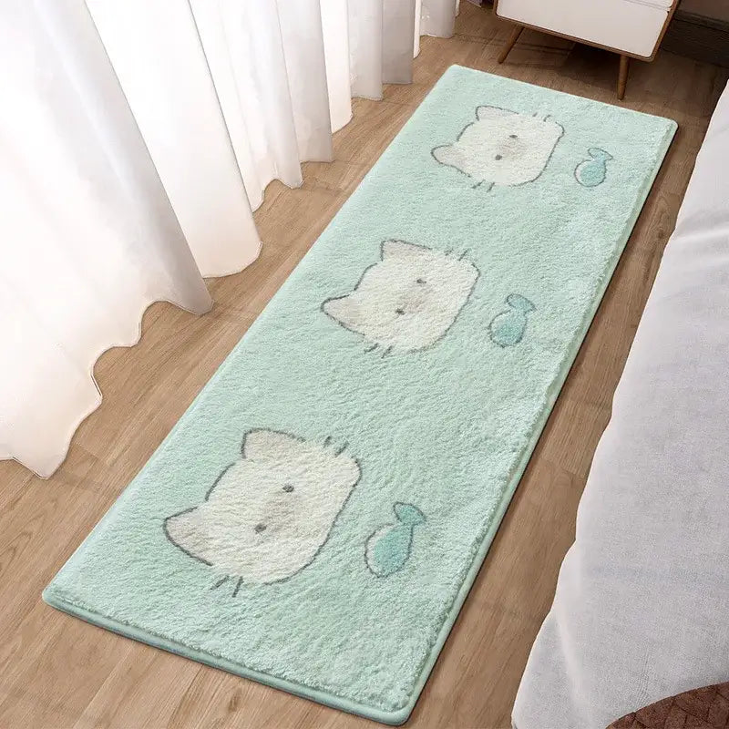Mint green plush bath mat with three white hello kitty faces and teal fish by decorbites lovely rabbit bedside rug
