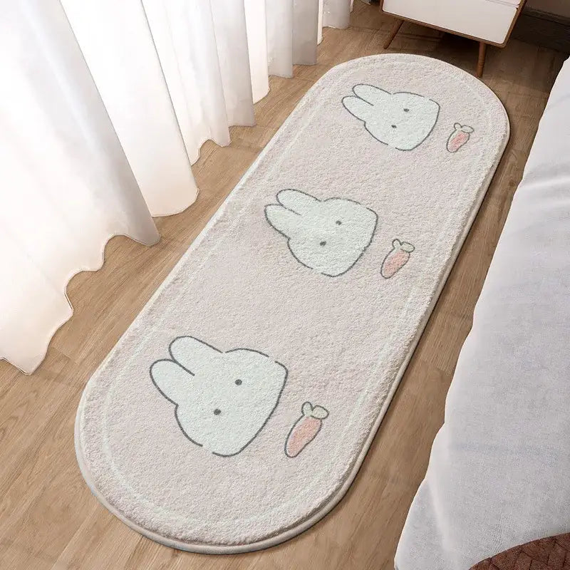 A soft off-white plush decorbites lovely rabbit pink bedside rug with three cartoon bunny faces and pink carrots