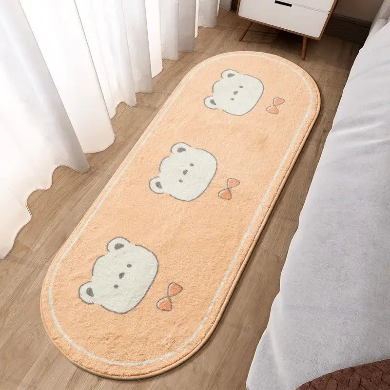 Soft peach-colored decorbites lovely rabbit pink bedside rug with three white bear faces and orange bows for girls room