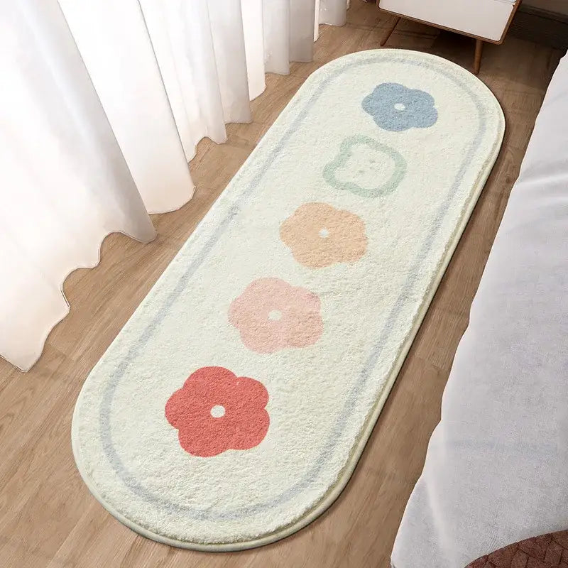 A cream-colored oval bath mat with pastel floral designs for decorbites lovely rabbit pink bedside use
