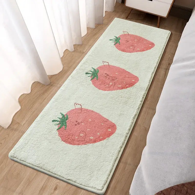 A soft light green plush bath mat with three pink strawberries for decorbites lovely rabbit pink bedside use