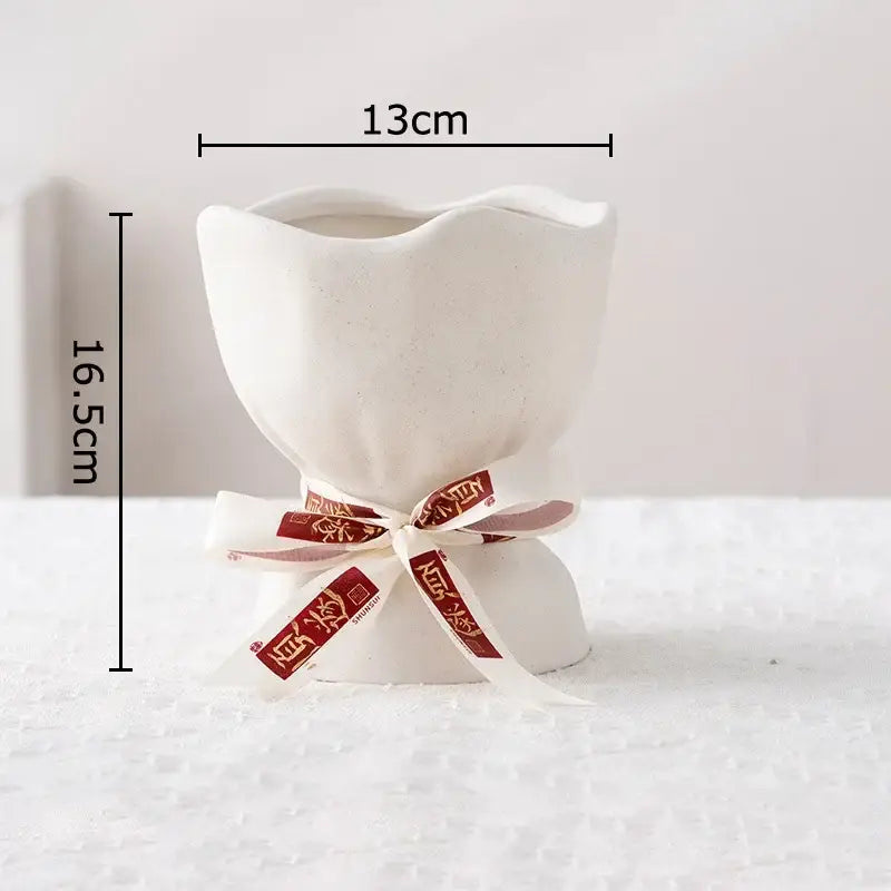 A white ceramic flower pot vase set with fluted rim and tied ribbon by DecorBites lovely ribbon ceramic collection