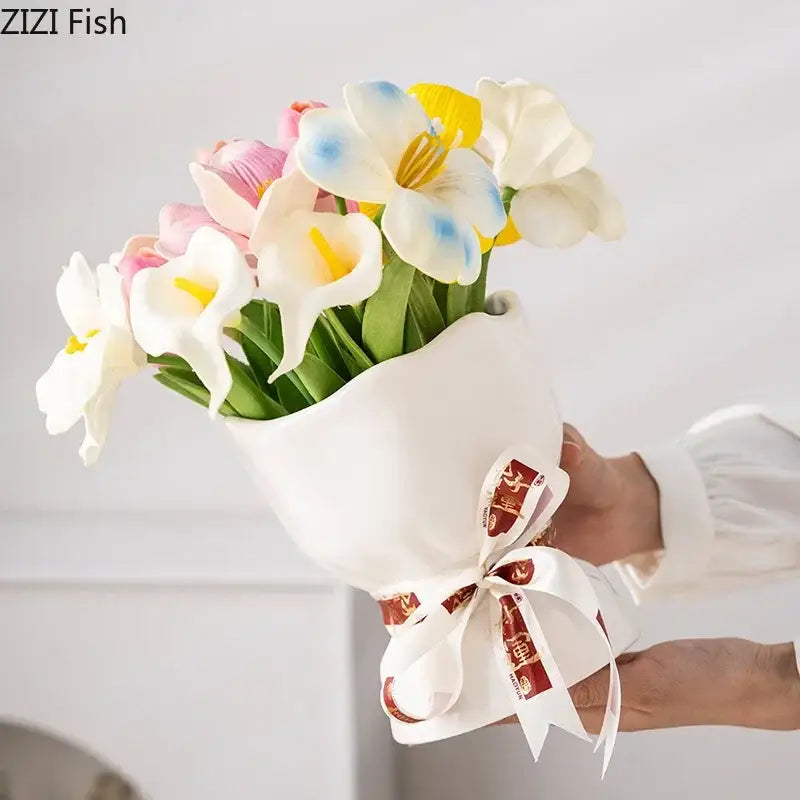 A decorbites lovely ribbon ceramic vase set featuring a bouquet of artificial pastel flowers wrapped in white paper