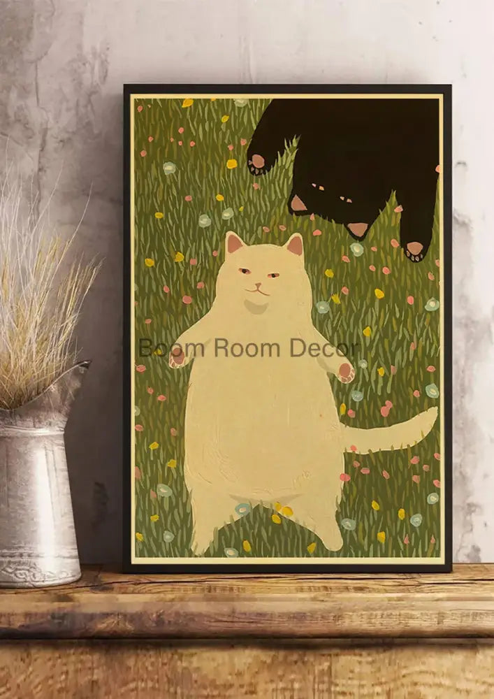 Black-framed DecorBites™ lover cat paper poster featuring a cream-colored and black cat standing in grass for home decor