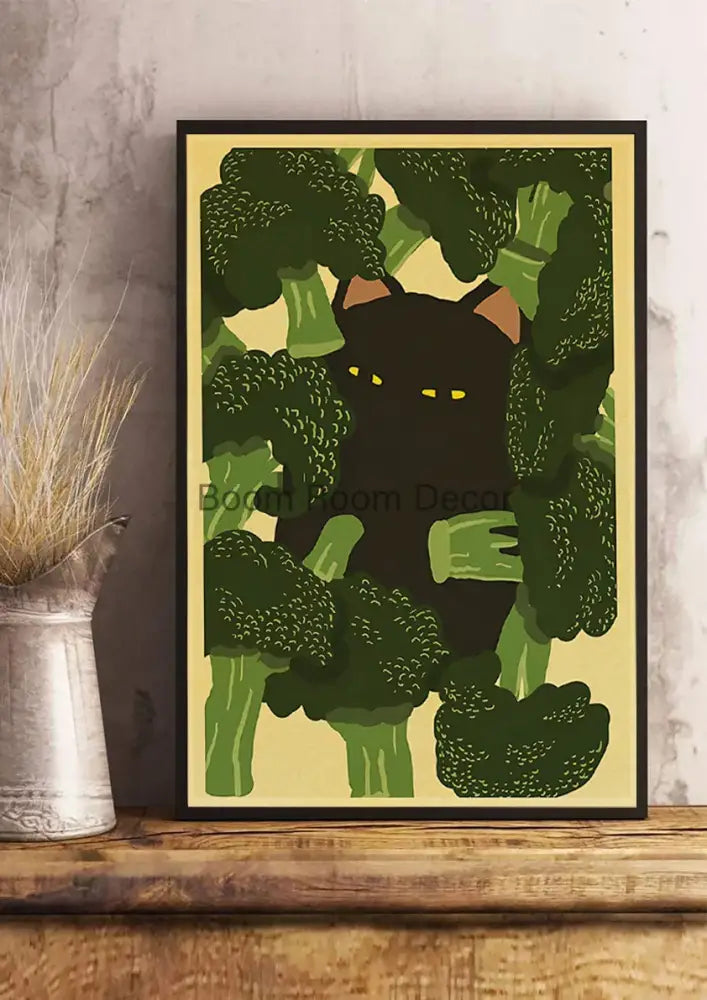A framed decorbites™ lover cat paper poster featuring a black cat with yellow eyes among green broccoli stalks on pale yellow background
