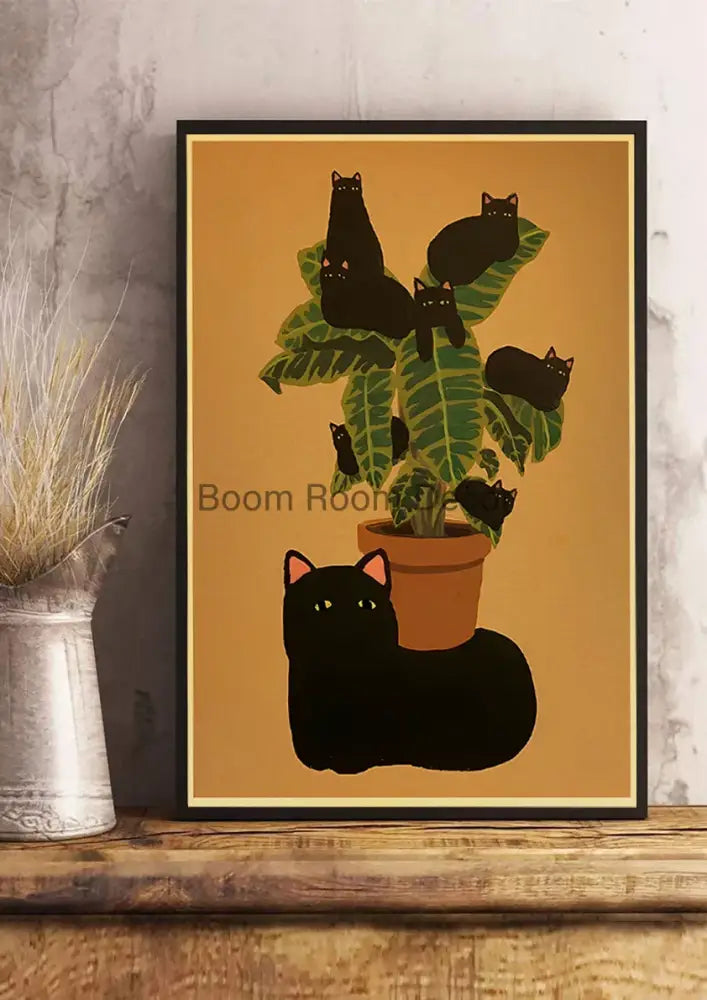 A framed DecorBites™ lover cat paper poster with black cats among green leaves and an orange pot for home decor