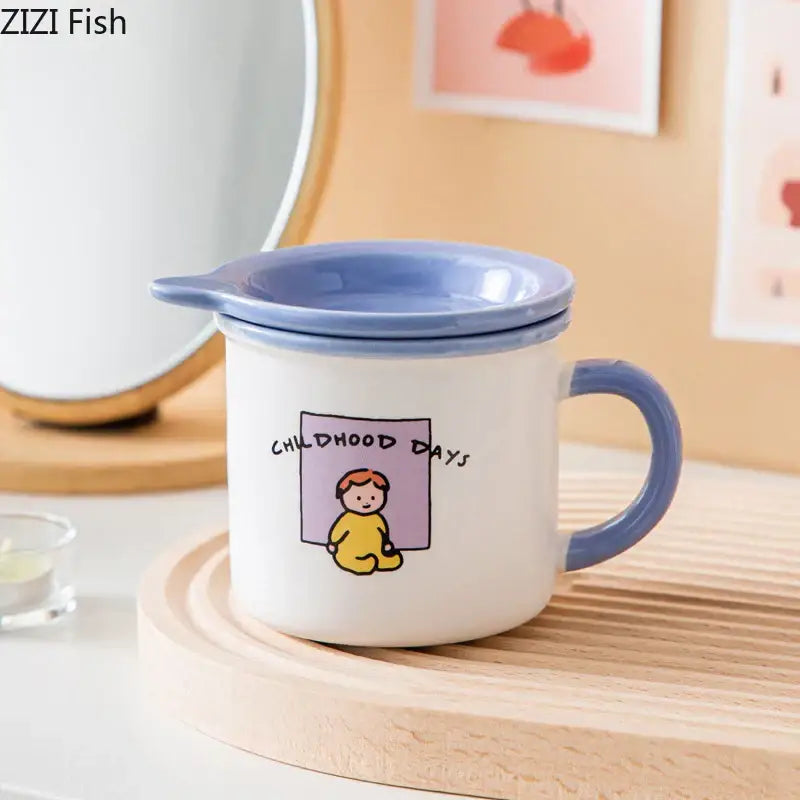 White ceramic coffee mug with blue lid and handle featuring decorbites lovers cartoon pattern and childhood days text