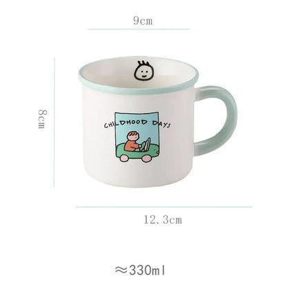 A white porcelain coffee mug with light green rim and lovers cartoon pattern featuring a child and childhood days text