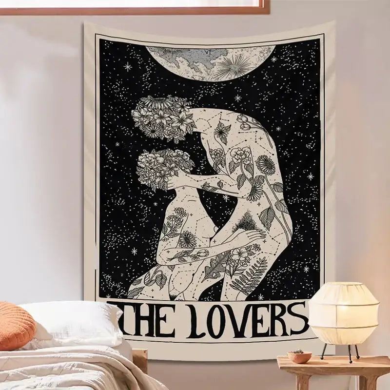 Black and white DecorBites lovers tarot tapestry featuring illustrated couple entwined with floral patterns and starry night backdrop