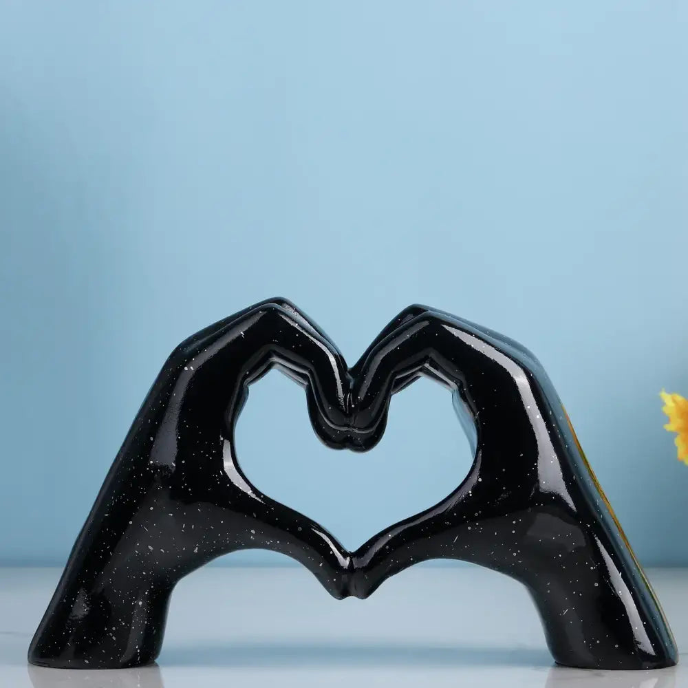 Black ceramic decorbites loving gesture heart sculpture with glossy speckled finish for home decor and gifts