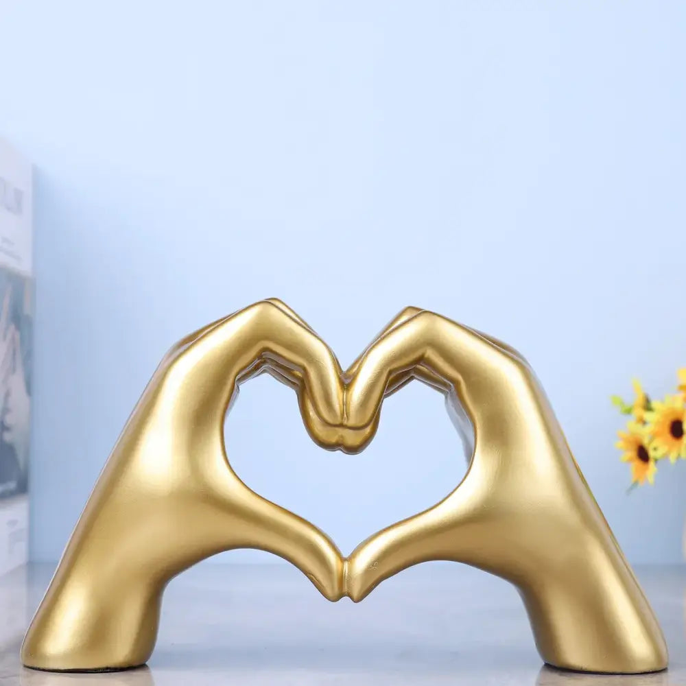 Decorbites loving gesture heart sculpture in glossy gold with smooth finish for home decor and wedding gifts