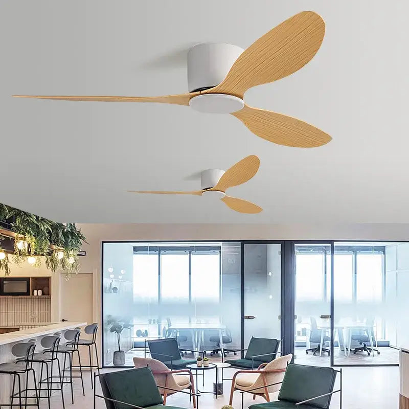 Modern decorbites low floor ceiling fan with three light wood blades and sleek white central housing controlled by remote