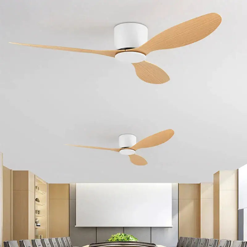 Modern ceiling fan with three light wood blades and sleek white housing by DecorBites low floor for stylish airflow control