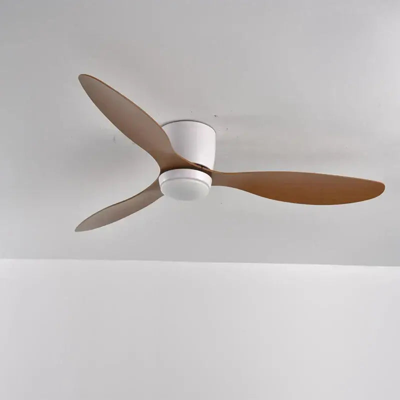 Modern decorbites low profile ceiling fan with remote control features three light brown wooden blades and white housing