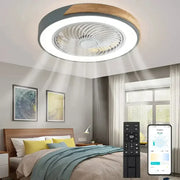 Modern circular decorbites low profile ceiling fan with remote control featuring gray and wood accents and integrated led light