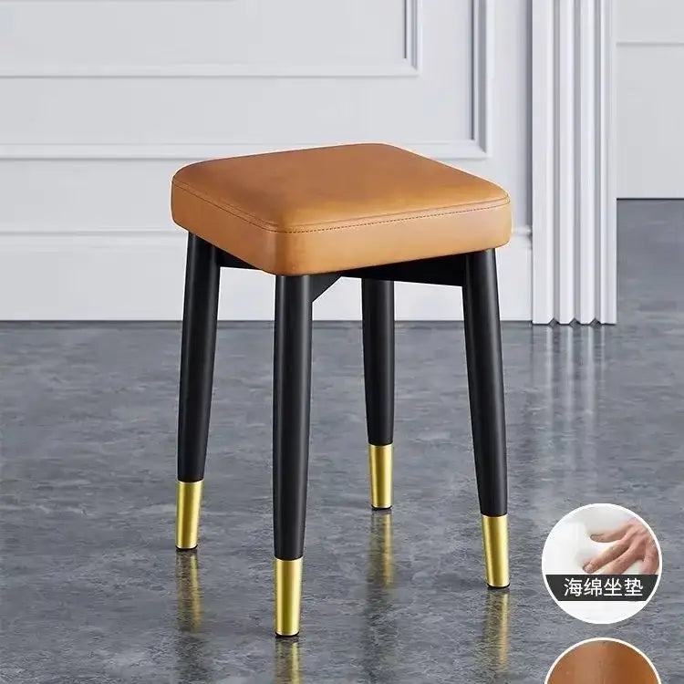 DecorBites low square tan leather stool bench with black legs and gold caps for dining kitchen use