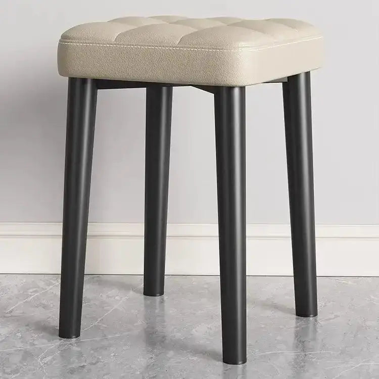 Beige tufted leather decorbites low square stool bench with sleek black metal legs for dining and kitchen use