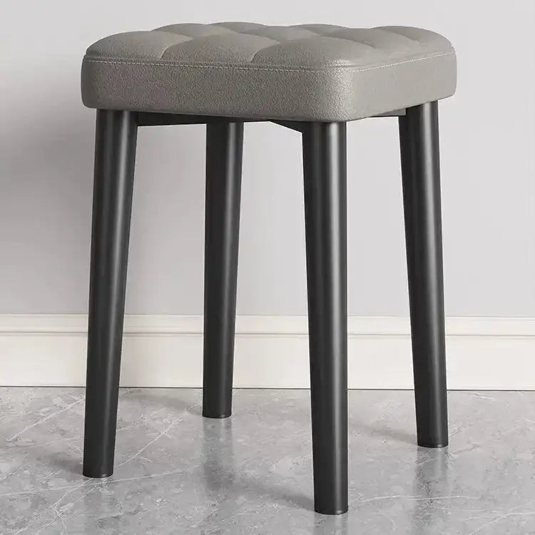 Gray tufted faux leather decorbites low square stool bench with sleek black metal legs for dining and kitchen use