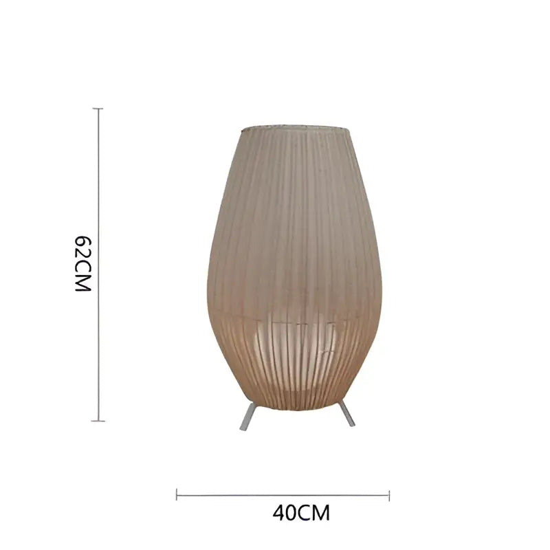 Tall beige woven rattan floor lamp with tapered design and metallic tripod base decorbites lucide colin rattan lamp