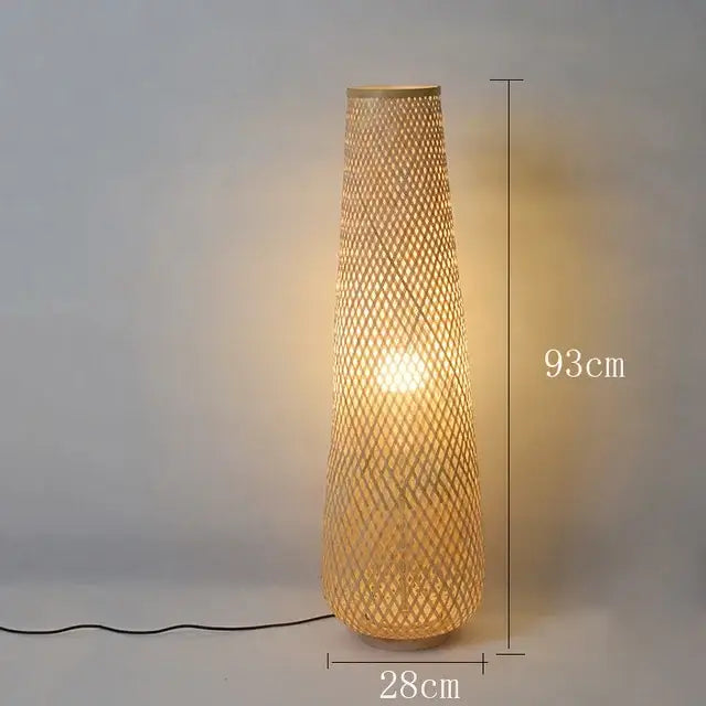 Tall slender decorbites lucide colin floor lamp with natural bamboo weave and warm glowing light for indoor use