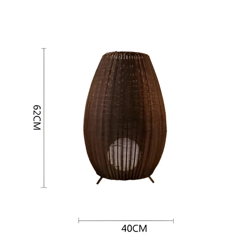 Brown woven wicker floor lamp with tapered design and black metal legs decorbites lucide colin rattan light