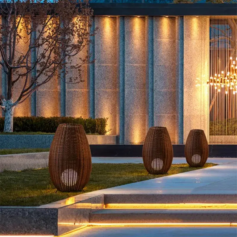 Woven brown wicker decorbites lucide colin rattan floor lamp with circular cutouts emitting warm light for indoor use
