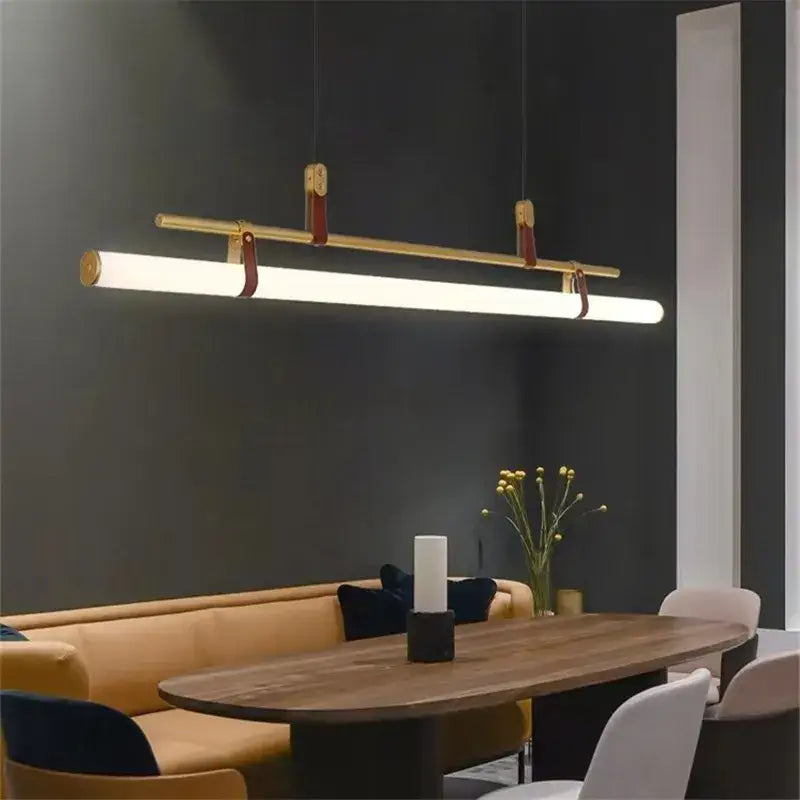 Gold-toned decorbites lucien tube chandelier with sleek rectangular led bar and brown leather straps pendant light fixture