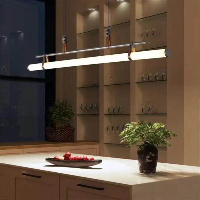 Modern minimalist decorbites lucien tube chandelier with chrome finish and warm white led, suspended by black gold leather straps