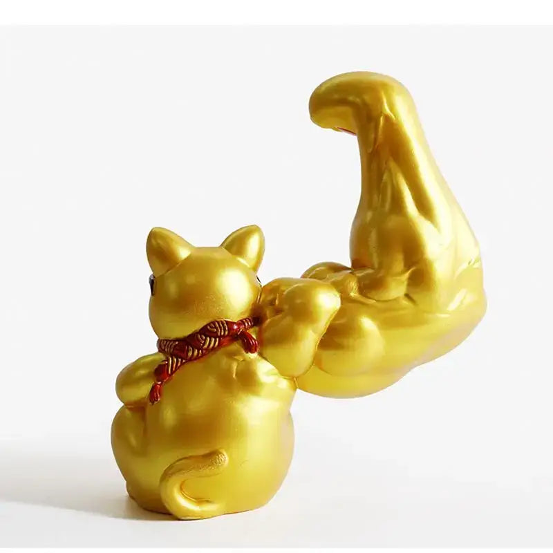 Golden decorbites lucky cat figurine with exaggerated muscular arm and red braided cord for feng shui decor