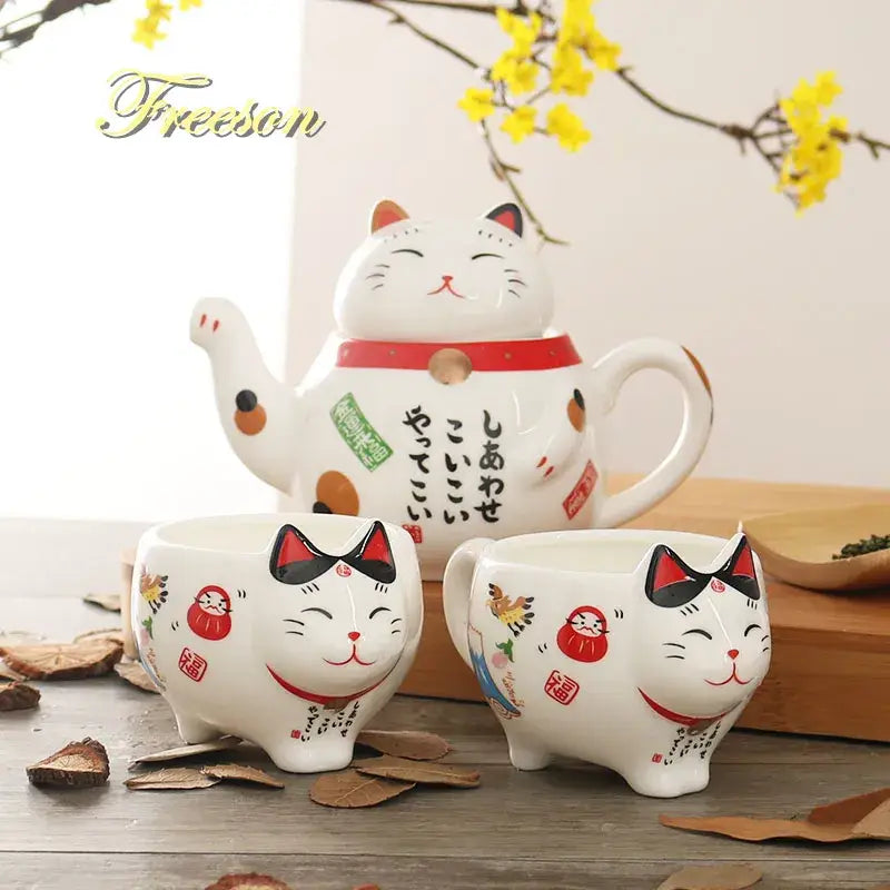 White ceramic tea set with smiling cat designs red accents black ears and japanese characters decorbites lucky cat porcelain