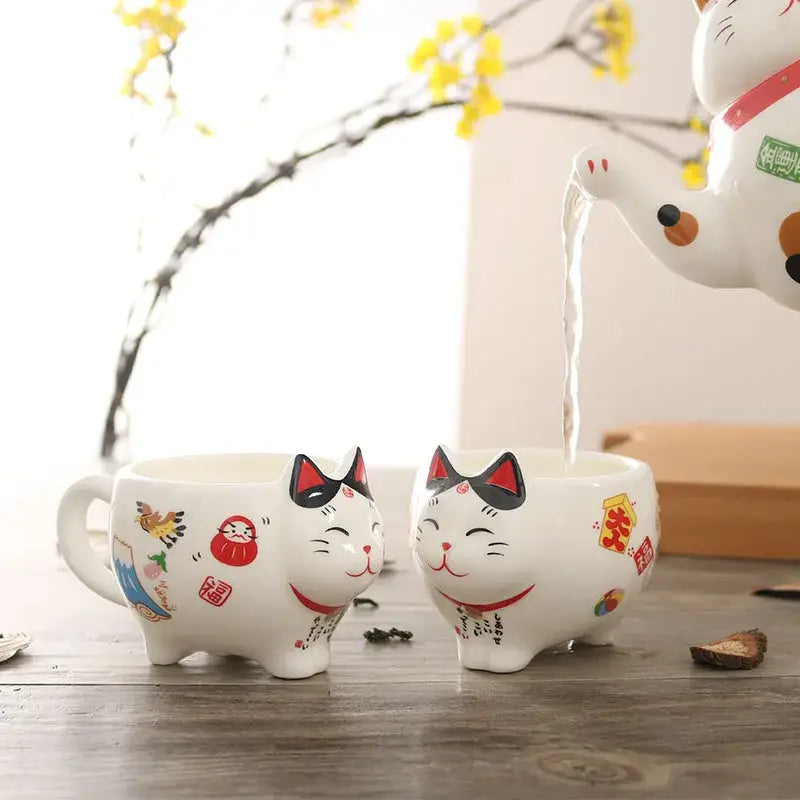 Decorbites lucky cat tea set featuring white ceramic lucky cat porcelain mugs with red accents and traditional designs