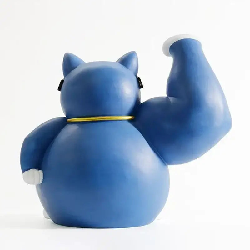 Blue ceramic lucky cat remote control figurine with muscular pose gold collar white paw tips by DecorBites
