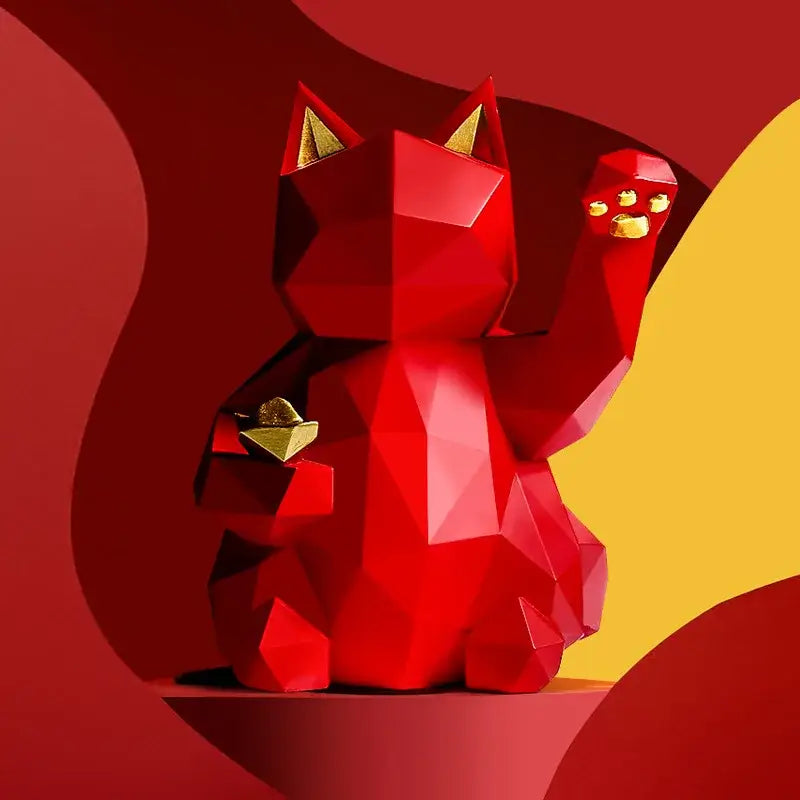 A vibrant red resin decorbites lucky cat figurine with geometric facets and gold accents for modern home decor