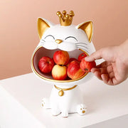 White ceramic decorbites lucky cat sculpture fruit bowl with gold crown holding red apples for modern table decor