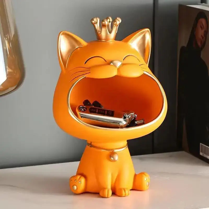 A cheerful orange decorbites lucky cat sculpture with golden crown and metallic accents for key and trinket storage