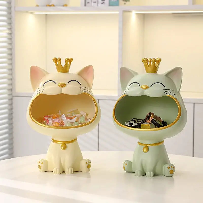 Two ceramic cat sculpture storage boxes in cream and mint green with gold crowns from DecorBites lucky cat figurines