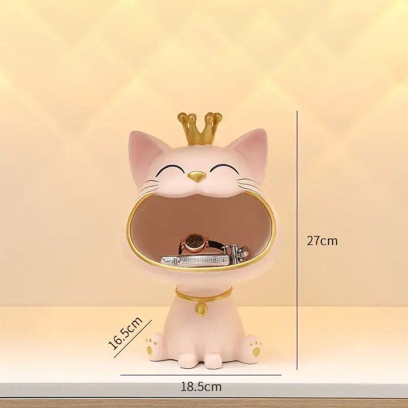 Pink ceramic lucky cat sculpture with gold crown and collar featuring open mouth storage for watches desk decor