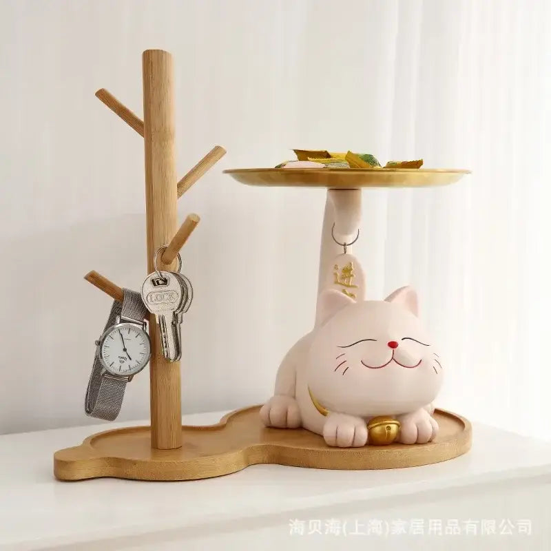 A charming pink ceramic decorbites lucky cat statue with a gold bell and red nose for home decor and storage