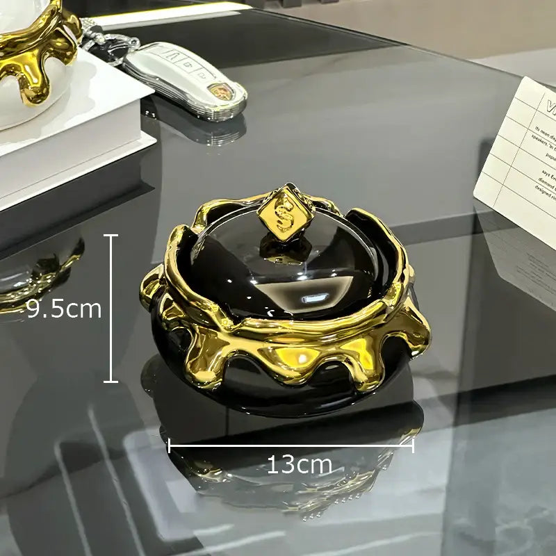 Black and gold ceramic ashtray with glossy finish and ornate dripping gold rim from decorbites lucky ceramic collection