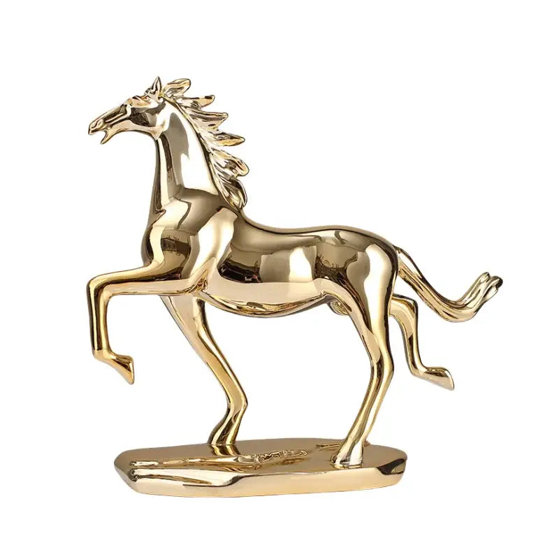 Golden metallic decorbites lucky horse resin figurine with polished finish in dynamic pose on oval base for home decor