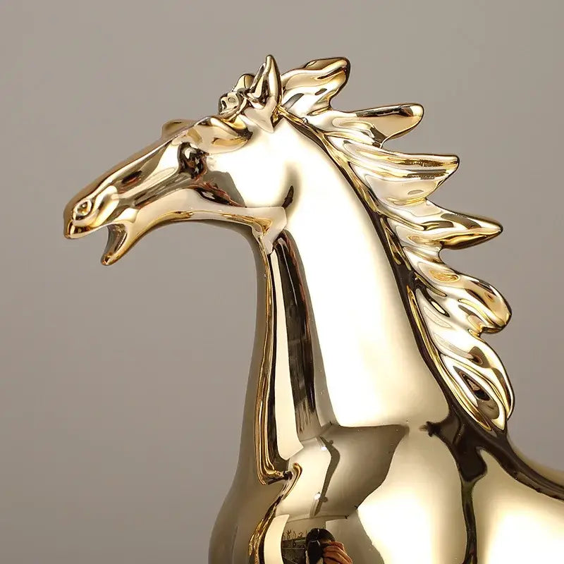 Shiny gold horse head sculpture with flowing mane and reflective surface from decorbites lucky horse resin home decor