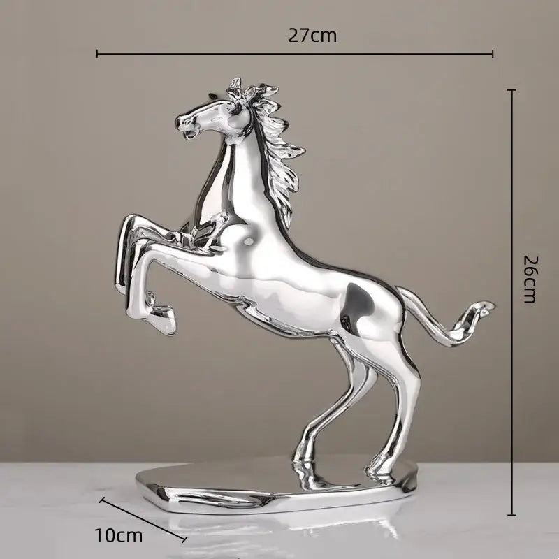Shiny silver metallic decorbites lucky horse resin sculpture in a sleek rearing pose for horse resin home decor