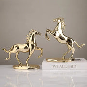 Two gold-colored polished metallic horse figurines by DecorBites lucky horse resin for elegant horse resin home decor