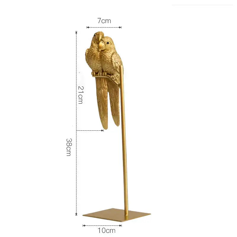 Golden metallic resin ornament of two parrots perched together on a slender stand decorbites lucky parrot design